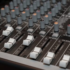 Audio mixer close-up representing DR Pulse Compressor plugin