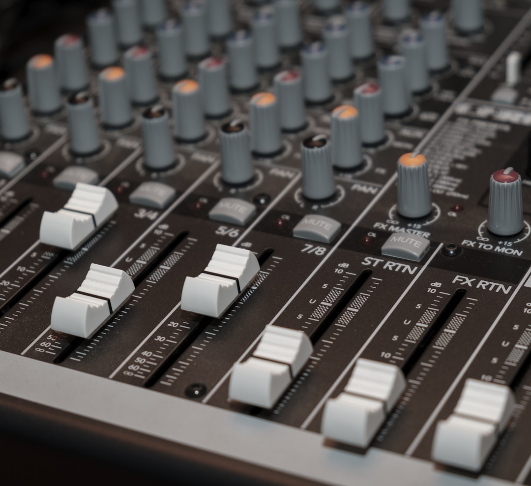 Audio mixer close-up representing DR Pulse Compressor plugin